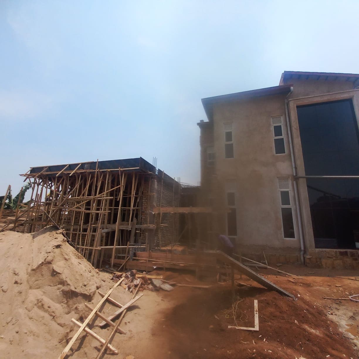 Structure rising — brickwork and formwork
